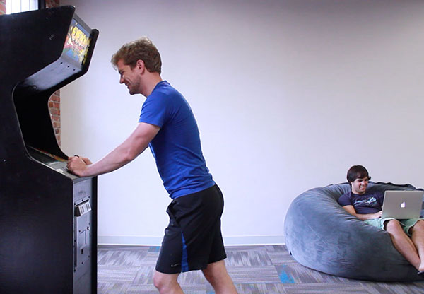 Chris and Tom playing and working in the office
